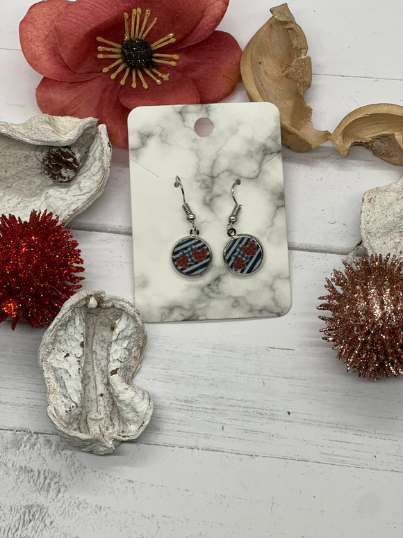 Small round black and white and red plaid/striped earrings