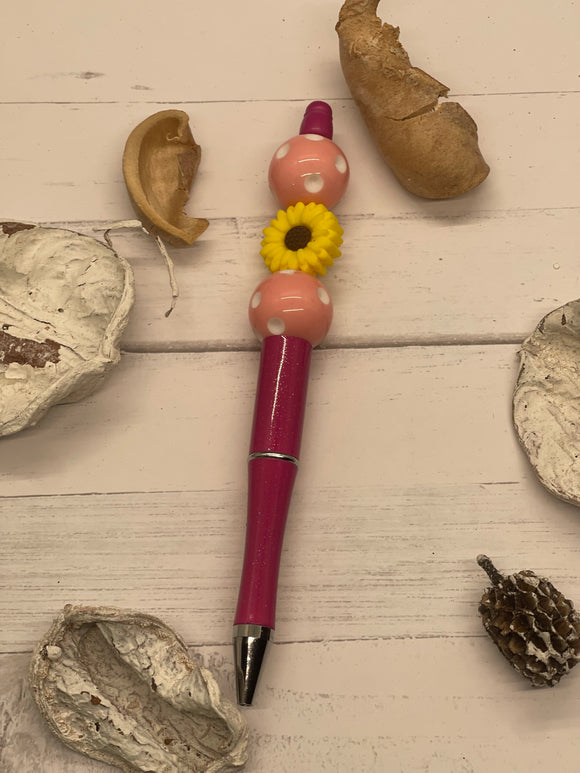 Pink beaded pen with yellow flower