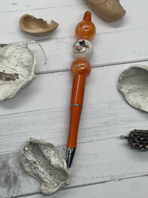 Beaded orange and gold with cow face pen