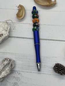 Blue Pen with Black Ink and Orange and Green Beads