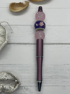 Purple beaded pen with purple flowered bead