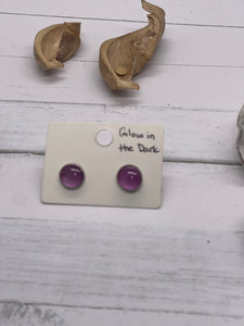 Small glow in the dark purple resin stud earrings